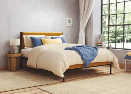 cream upholstered bed
